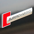 Emblema auto model "SUPERCHARGED", reliefata 3D, dimensiune 10 x 1 cm